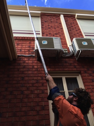 Ozwide Gutter Cleaning - Gutter cleaning using extension pole.
